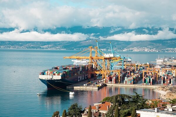 Port in Rijeka and a cargo ship